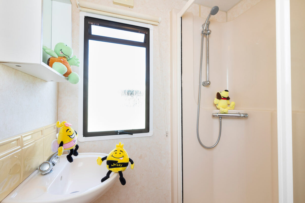 Light and clean bathroom in the Blue Reef Caravan at Welcome Family Holiday Park