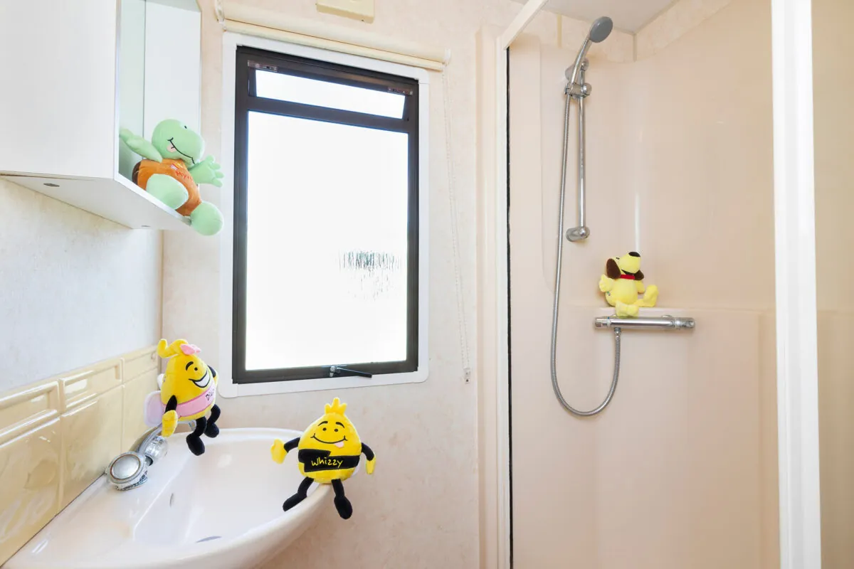 Light and clean bathroom in the Blue Reef Caravan at Welcome Family Holiday Park