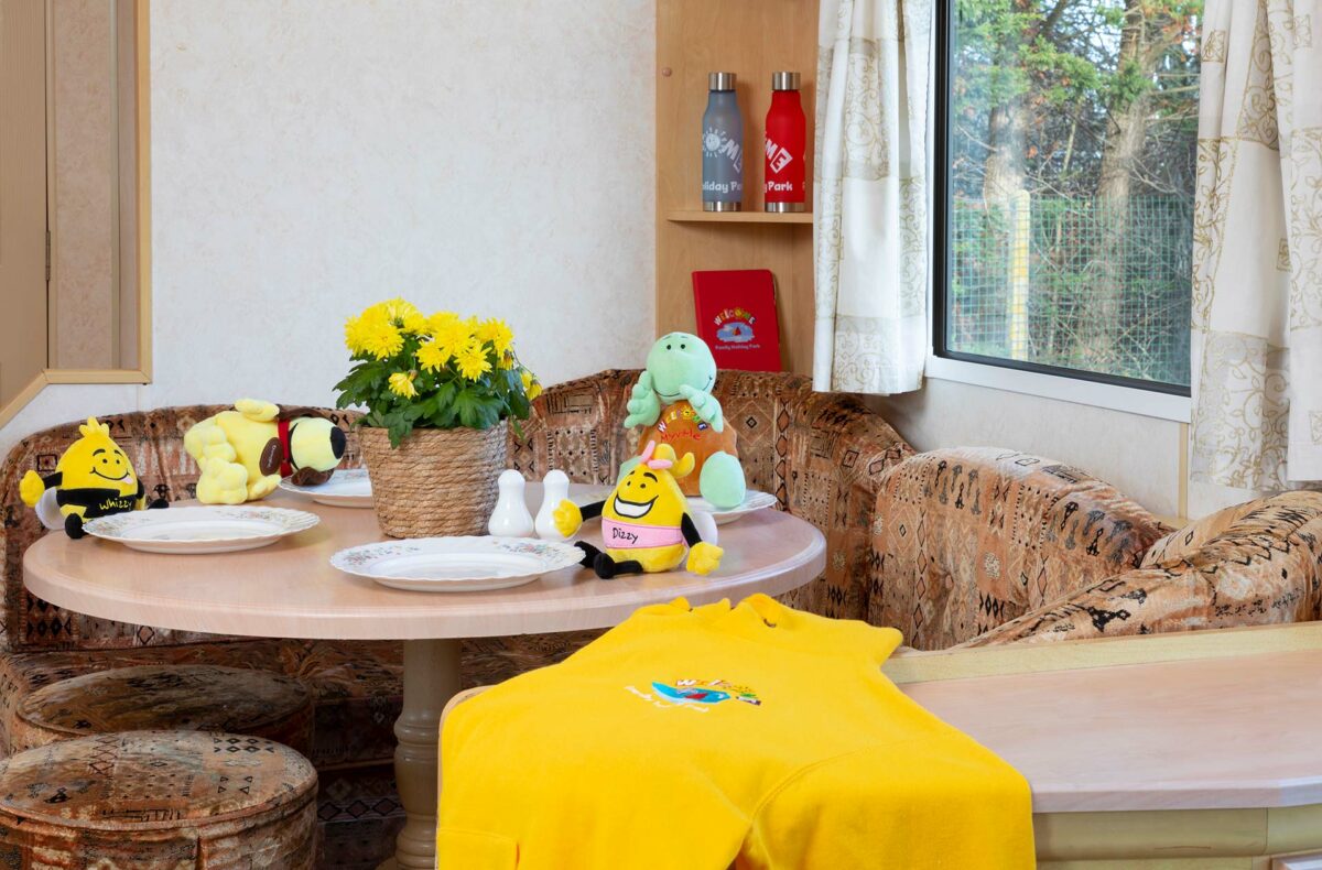 Table set for dinner in the Blue Reef Caravan at Welcome Family Holiday Park