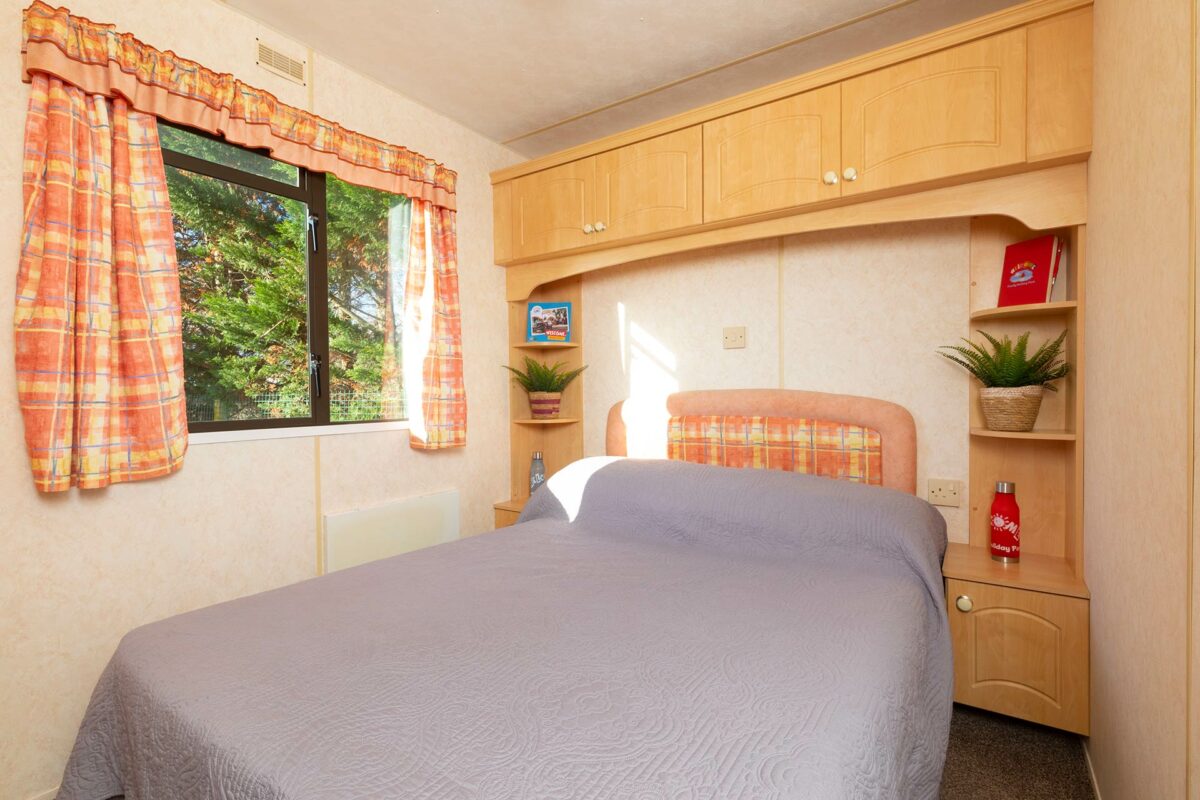 Double bedroom in the Blue Reef Caravan at Welcome Family Holiday Park