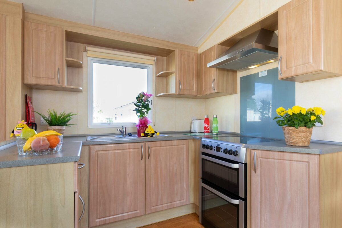 Clean kitchen area in the Coral Reef Caravan at Welcome Family Holiday Park