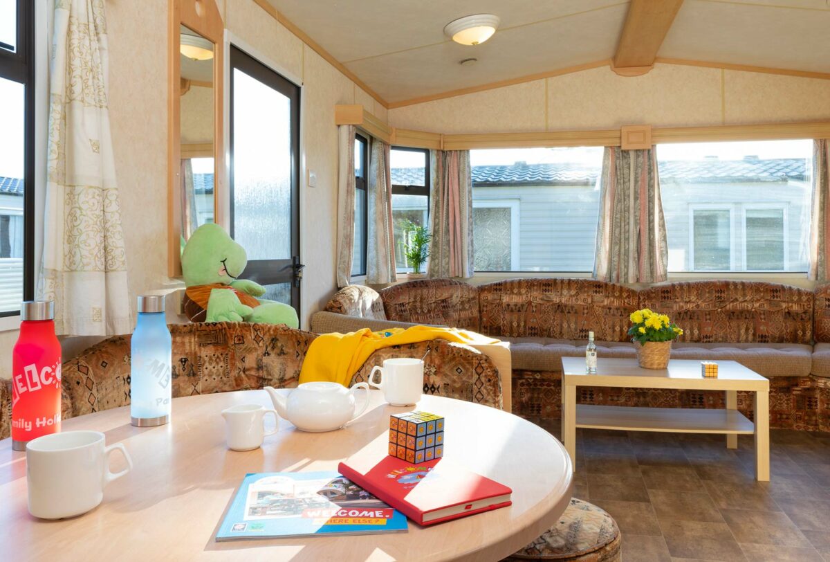 Living area in the Blue Reef Caravan at Welcome Family Holiday Park