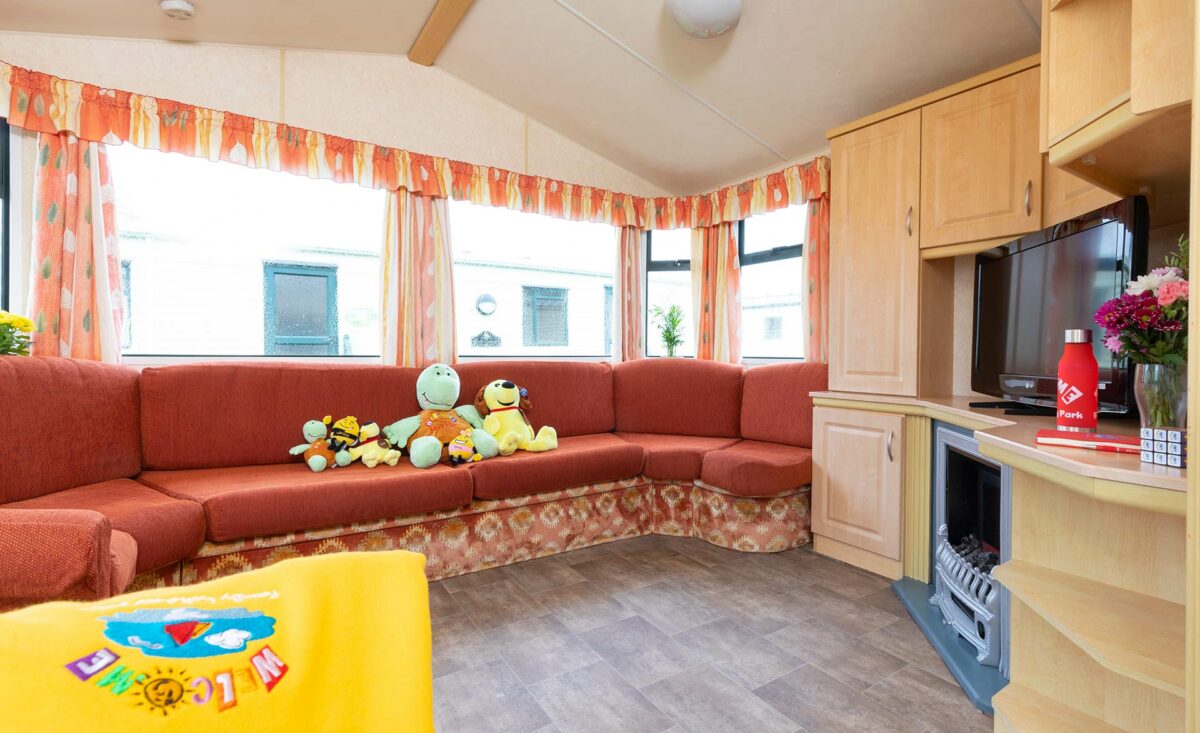 Lounge area in the Sunset caravan at the Welcome Family Holiday Park