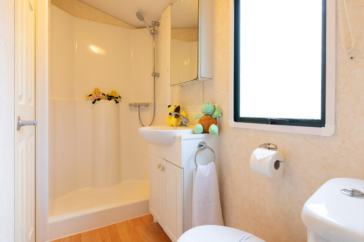 Bright and airy bathroom in the Sunset caravan at the Welcome Family Holiday Park