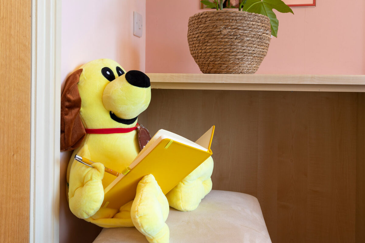 Dougie writing his diary in the Casafina lodge in Welcome Family Holiday Park