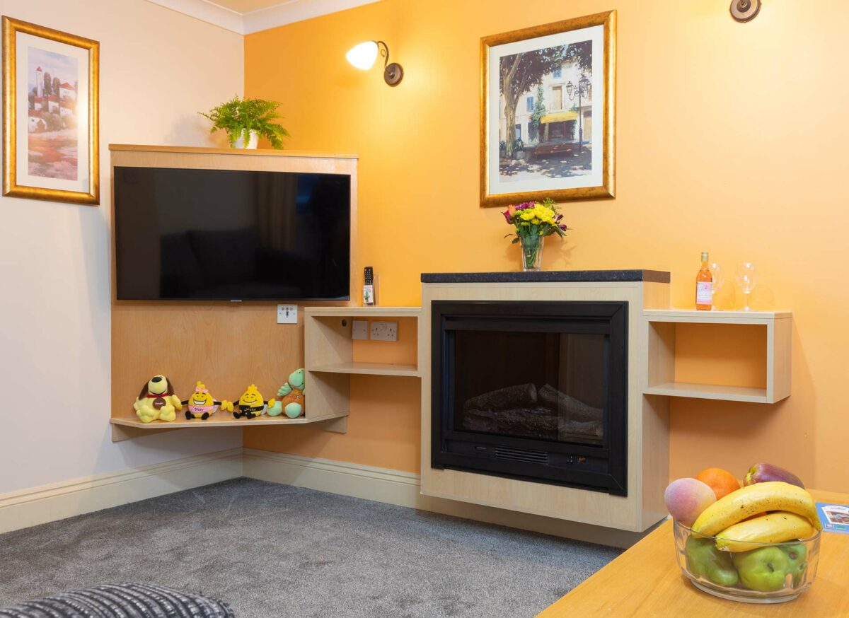 Cosy fire and tv in the Casamigo lodge at the Welcome Family Holiday Park