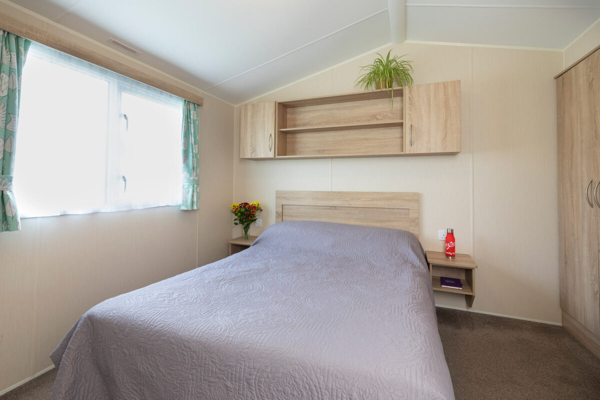 Comfortable master bedroomin the Casario premier caravan at Welcome Family Holiday Park