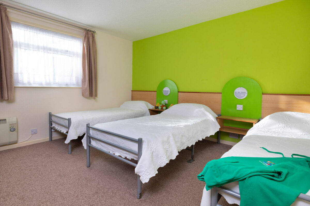 Bright and colourful triple bedroom in Starsurfer bungalow at Welcome Family Holiday Park