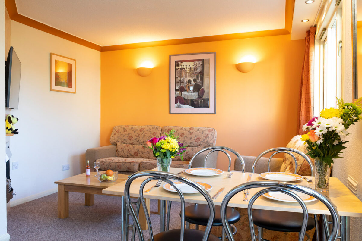 Living area in the Wavesurfer bungalow at Welcome Family Holiday Park