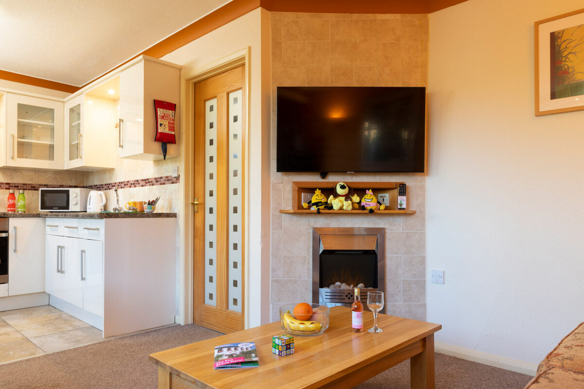 Cosy coffee table in the Wavesurfer bungalow at Welcome Family Holiday Park