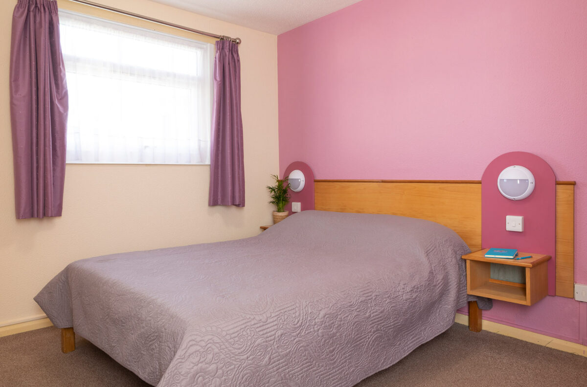 Master bedroom in the Wavesurfer bungalow at Welcome Family Holiday Park