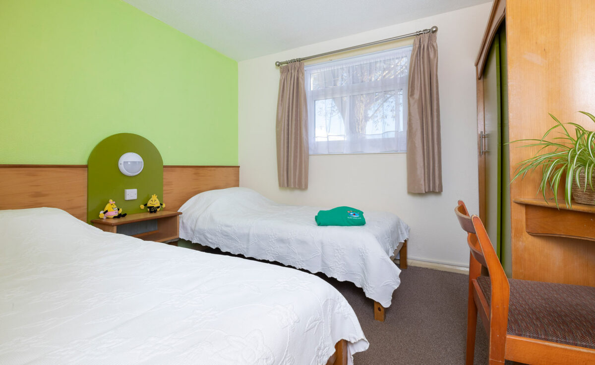 Twin bedroom in the Wavesurfer bungalow at Welcome Family Holiday Park