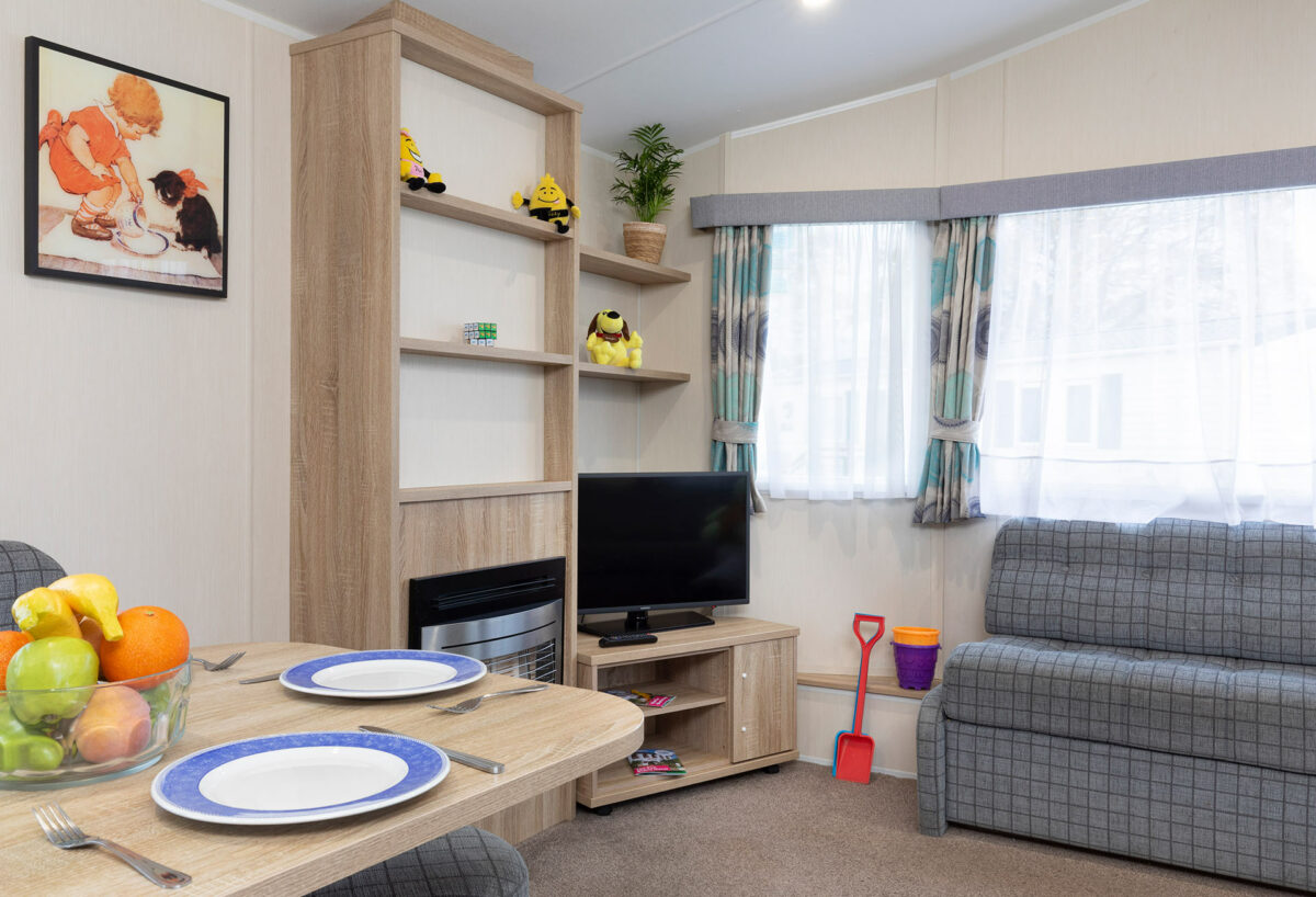 Living area with beach toys in the CasaMor premier caravan at Welcome Family Holiday Park