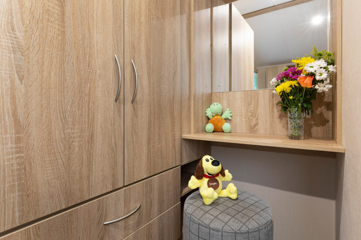 Vanity unit in the master bedroom in the CasaMor premier caravan at Welcome Family Holiday Park