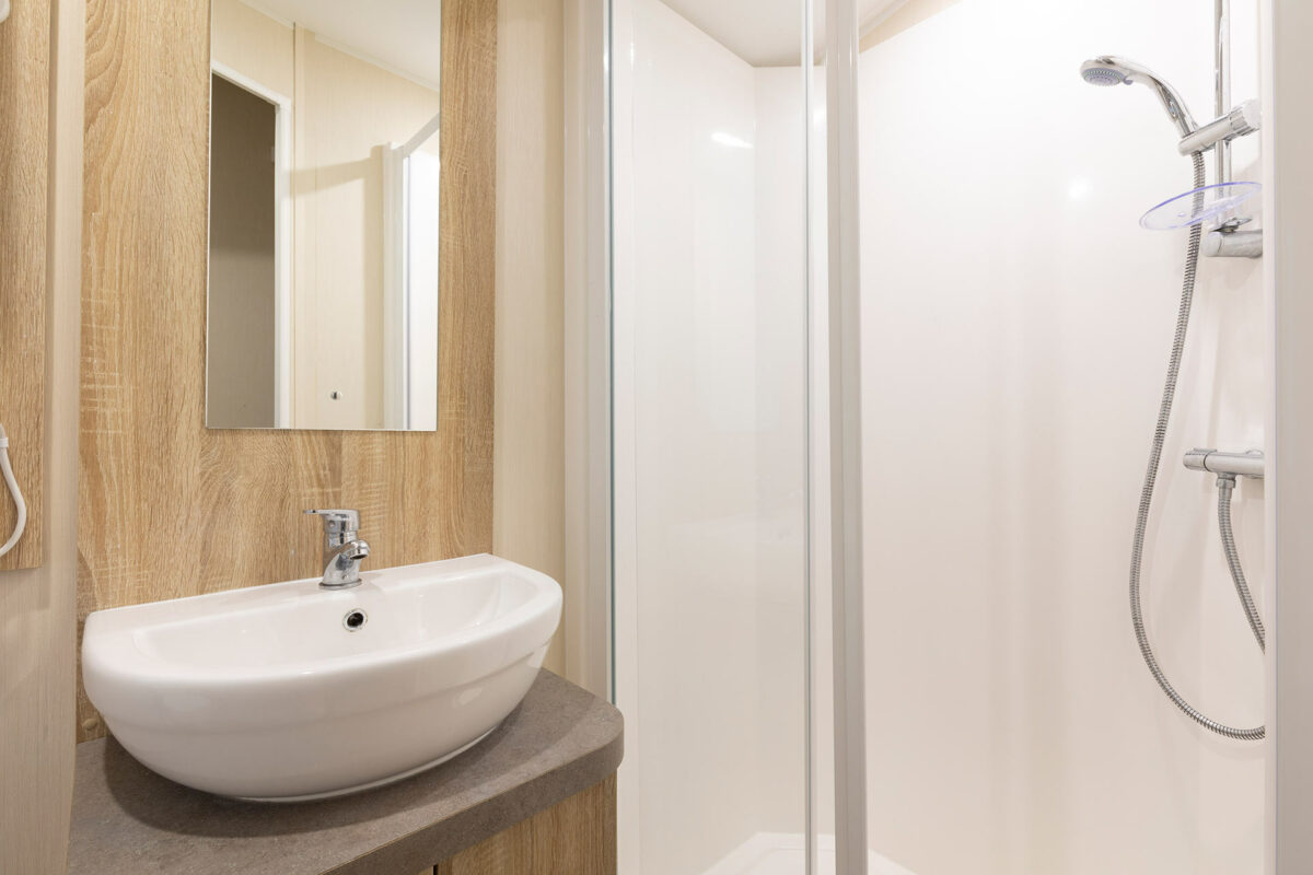 Clean and bright shower room in the CasaMor premier caravan at Welcome Family Holiday Park