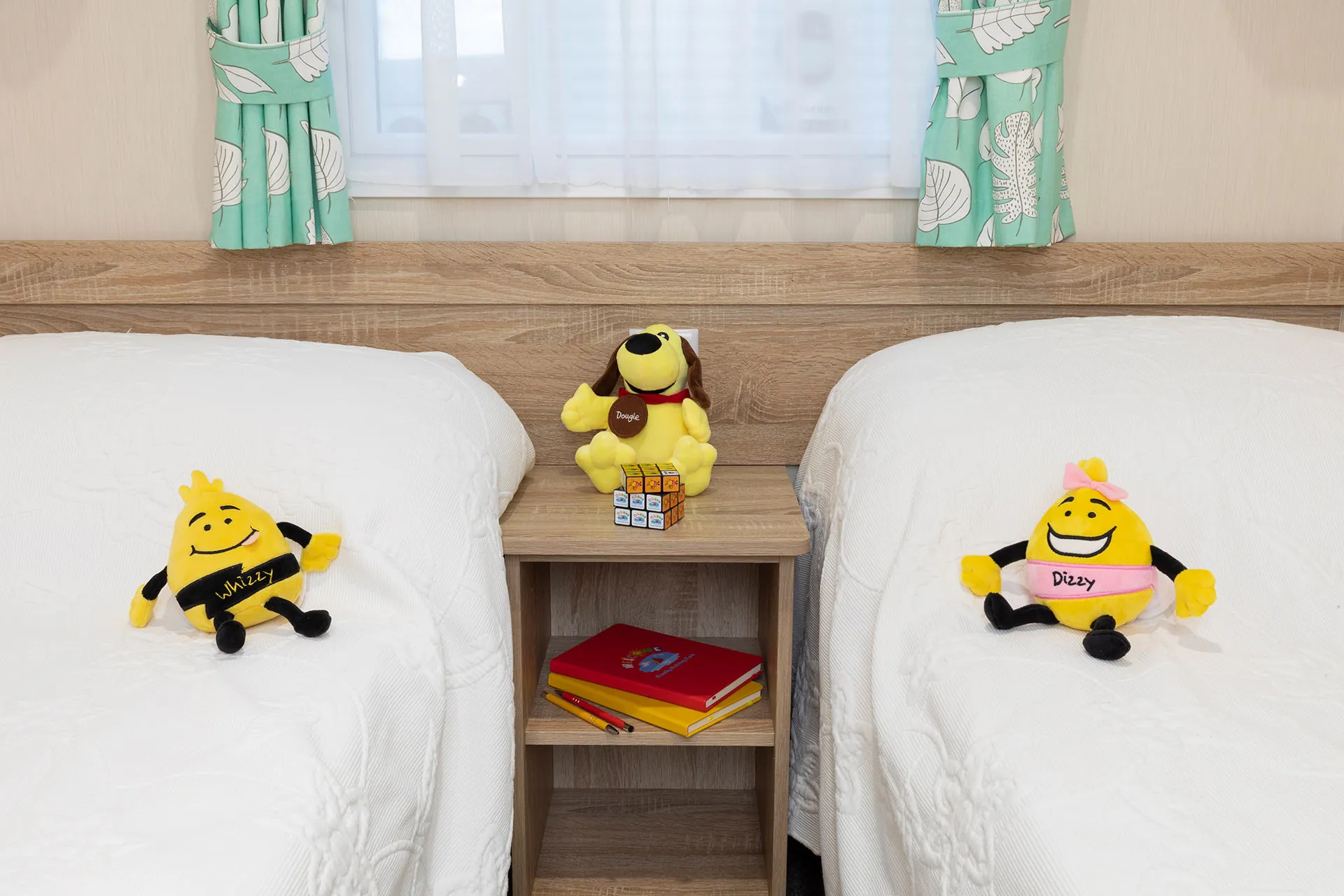 Cute and cosy twin bedroom in the CasaMor premier caravan at Welcome Family Holiday Park