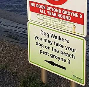 Dog walking sign on Dawlish Warren. Dogs allowed on beach, Dawlish Warren, South Devon