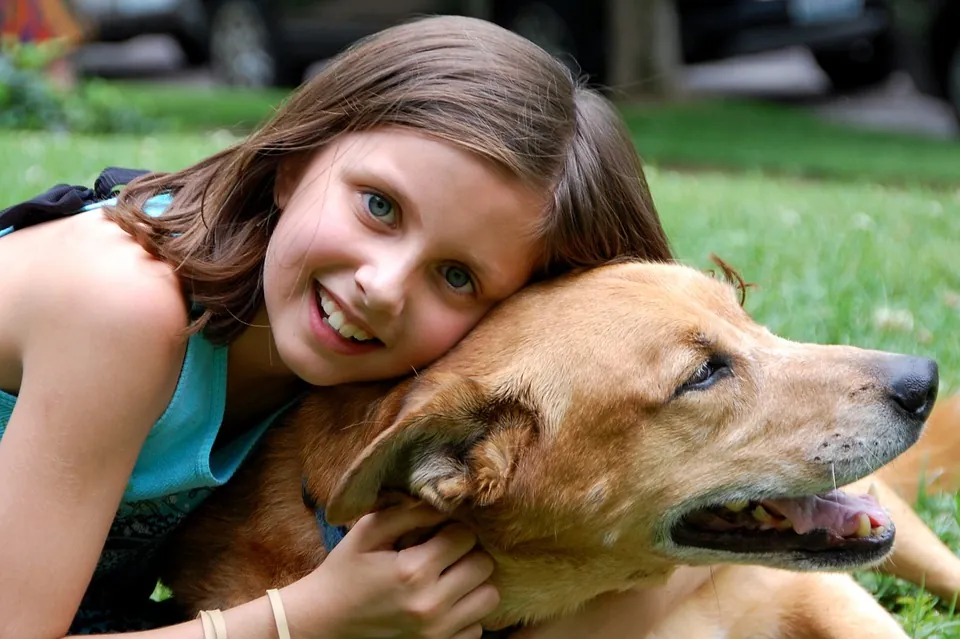 Girl cuddling a dog Pet friendly accommodation in devon