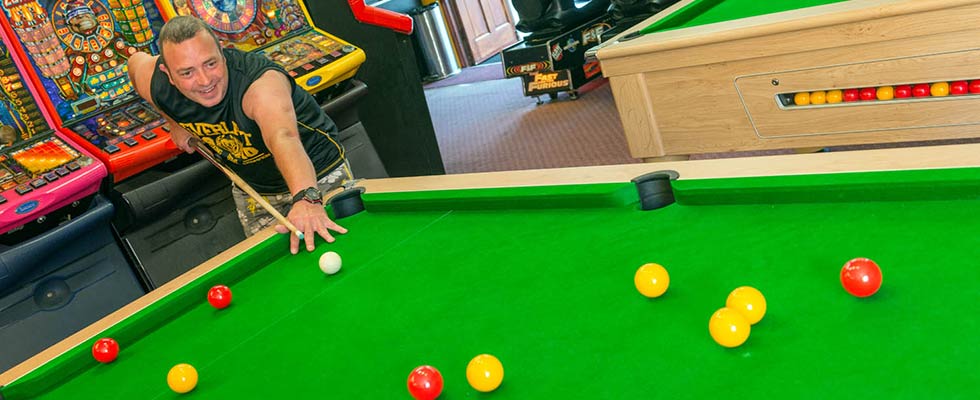 Man playing Pool at Welcome Family Holiday Park in Games Room