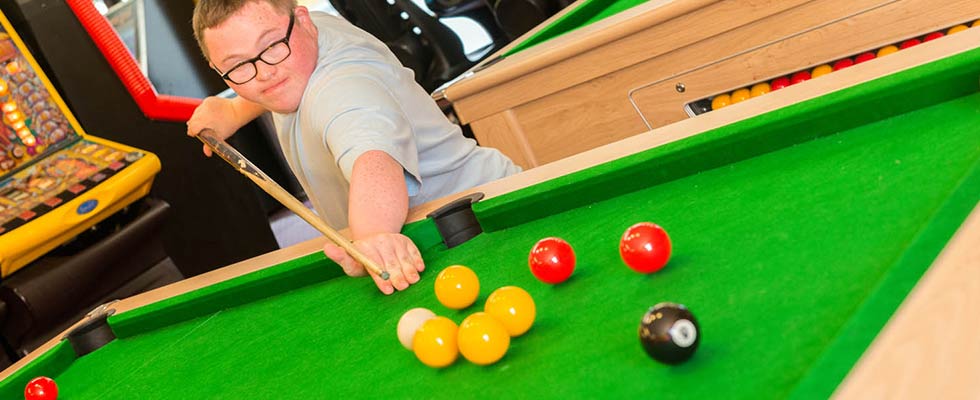 Boy playing Pool at Welcome Family Holiday Park in Games Room