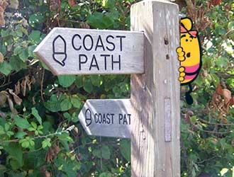 http://Dizzy%20the%20Bee%20is%20hiding%20behind%20a%20sign%20on%20the%20South%20West%20Coast%20Path