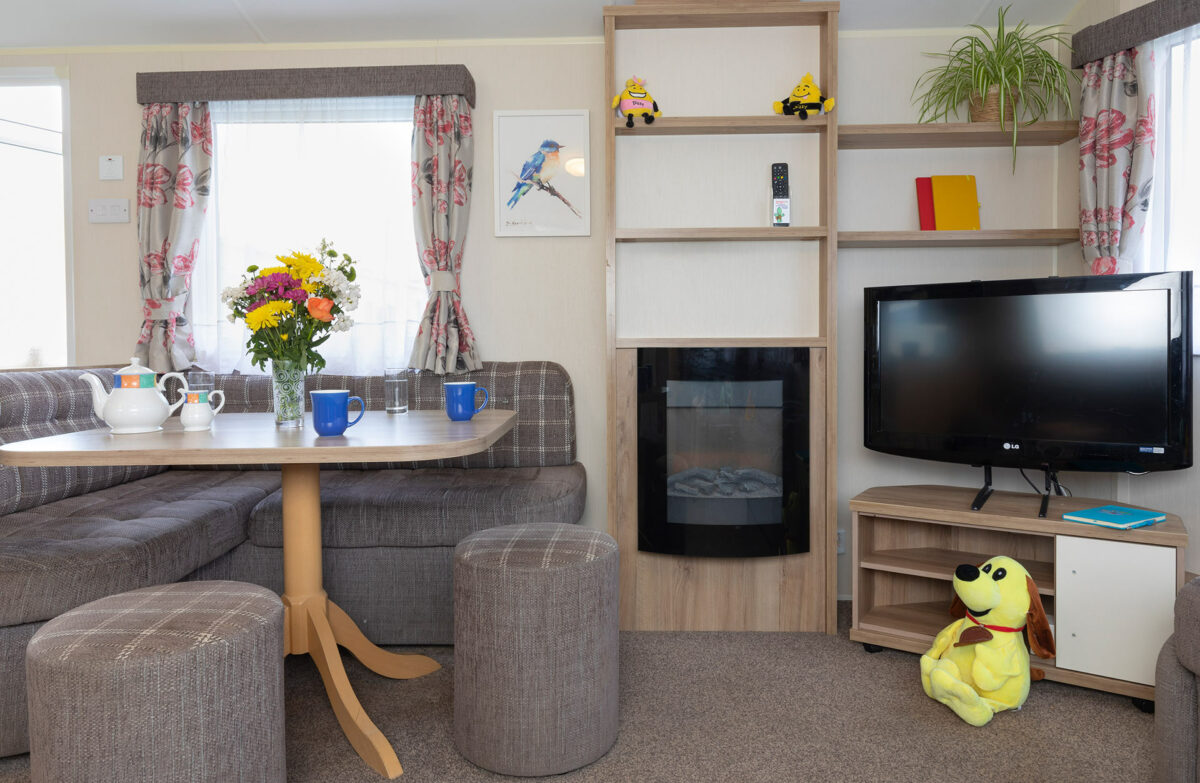 Comfy and bright living area in the Casario premier caravan at Welcome Family Holiday Park