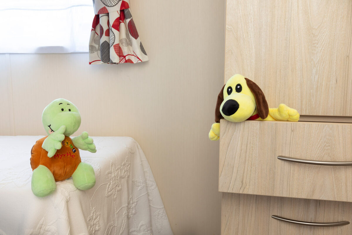 Peek a boo Dougie in the twin bedroom in the Casario premier caravan at Welcome Family Holiday Park