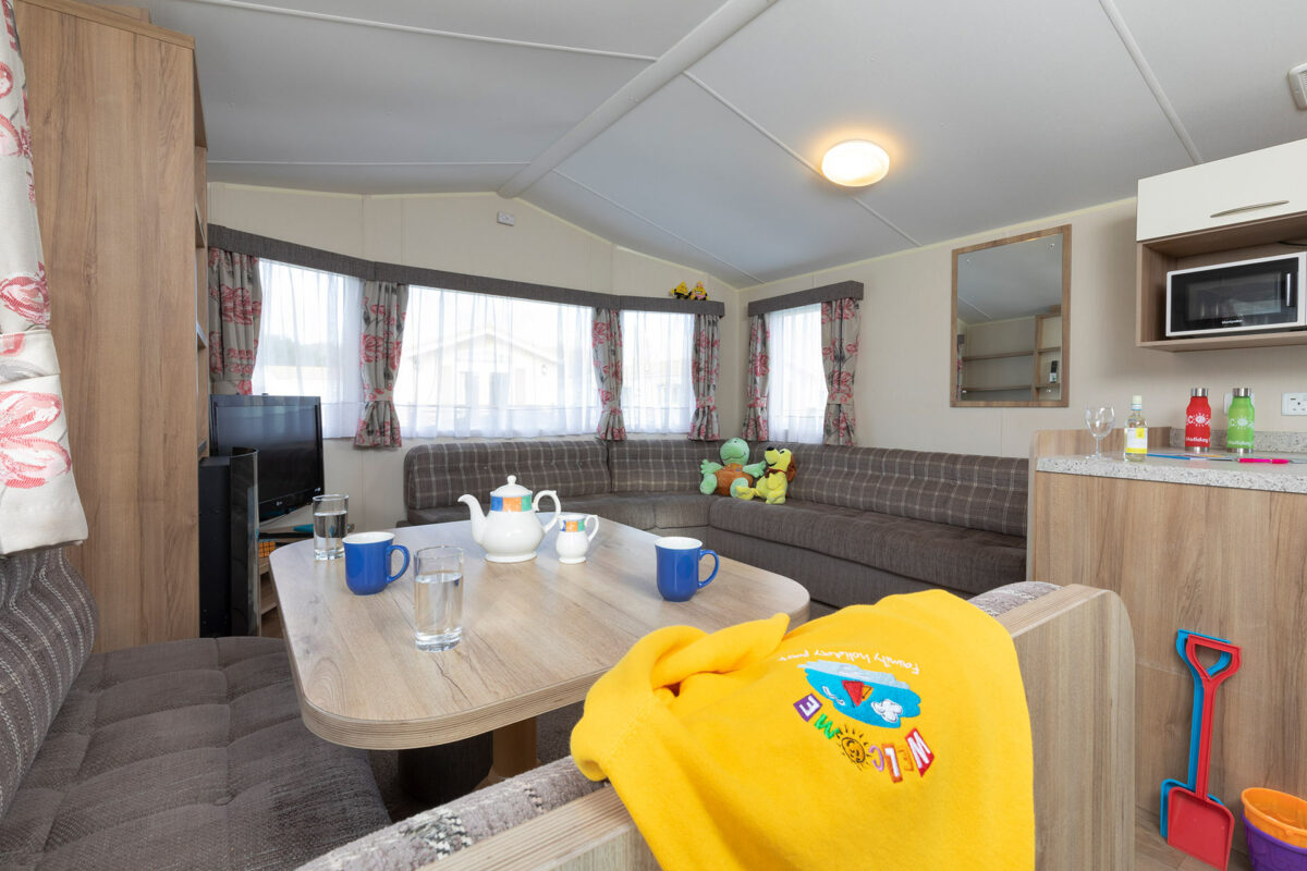 Living area in the Casario premier caravan at Welcome Family Holiday Park