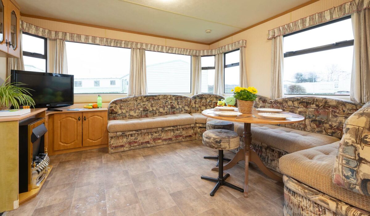 Clean and bright living area in the Moonlight Caravan at Welcome Family Holiday Park