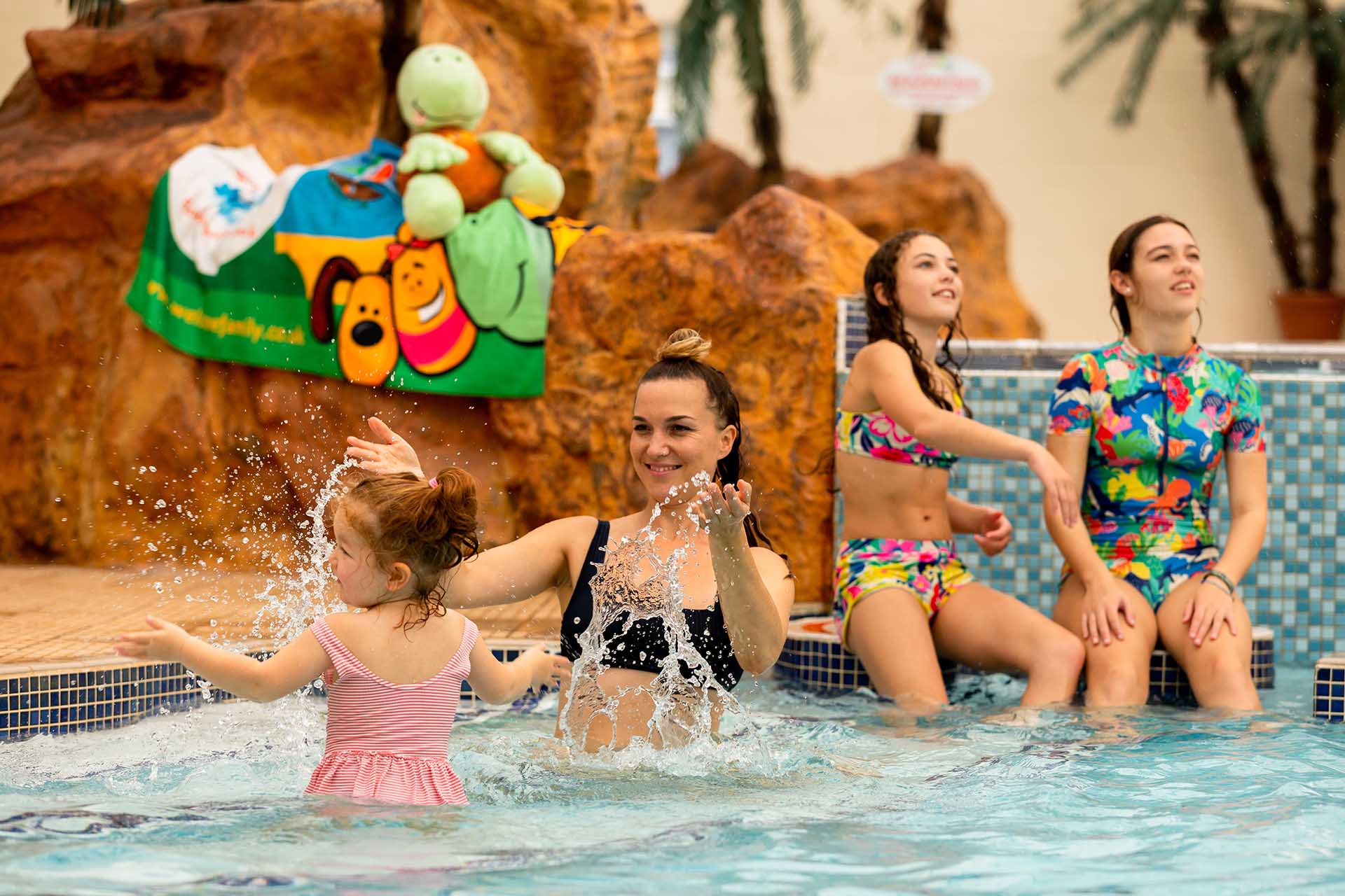 Family playing in Welcome swimming pool