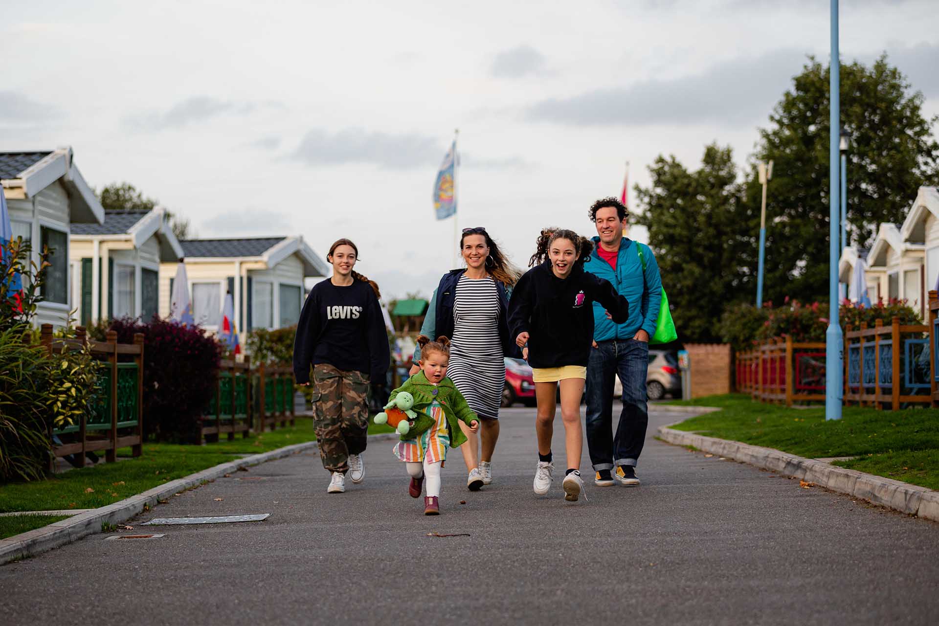 Family walking on the Welcome park