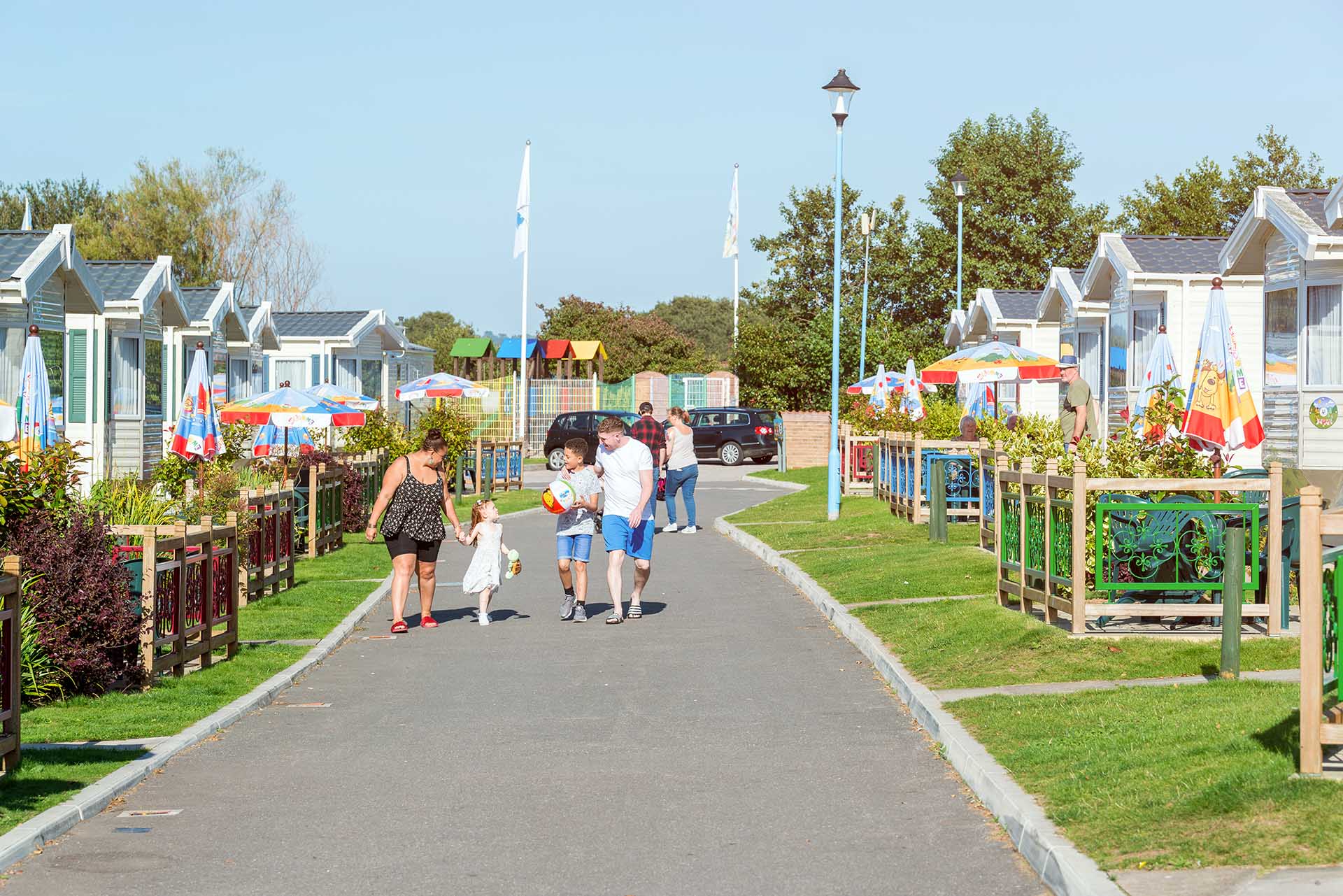 Family walking around Welcome on sunny day