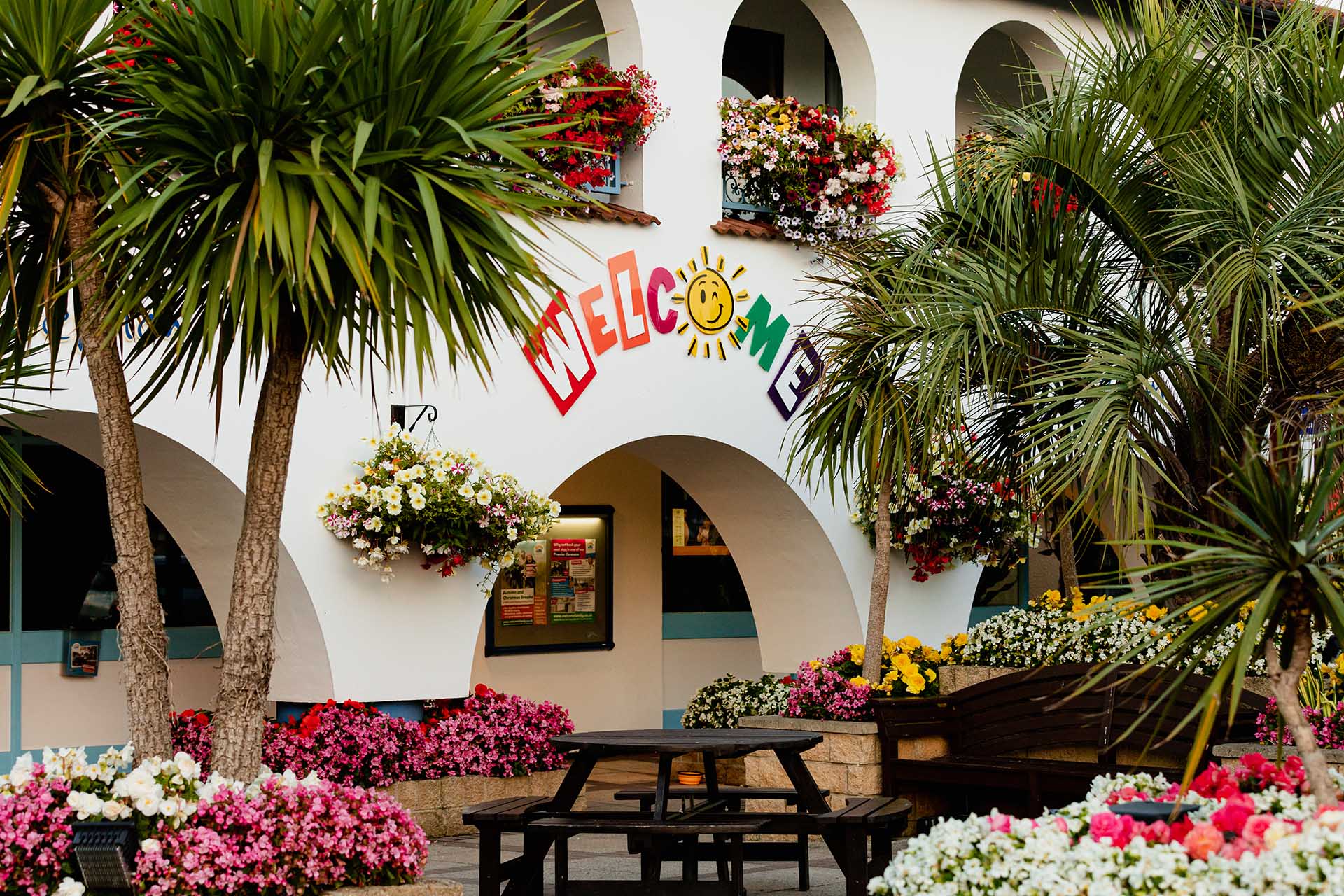 Welcome Reception with flowers and palm trees