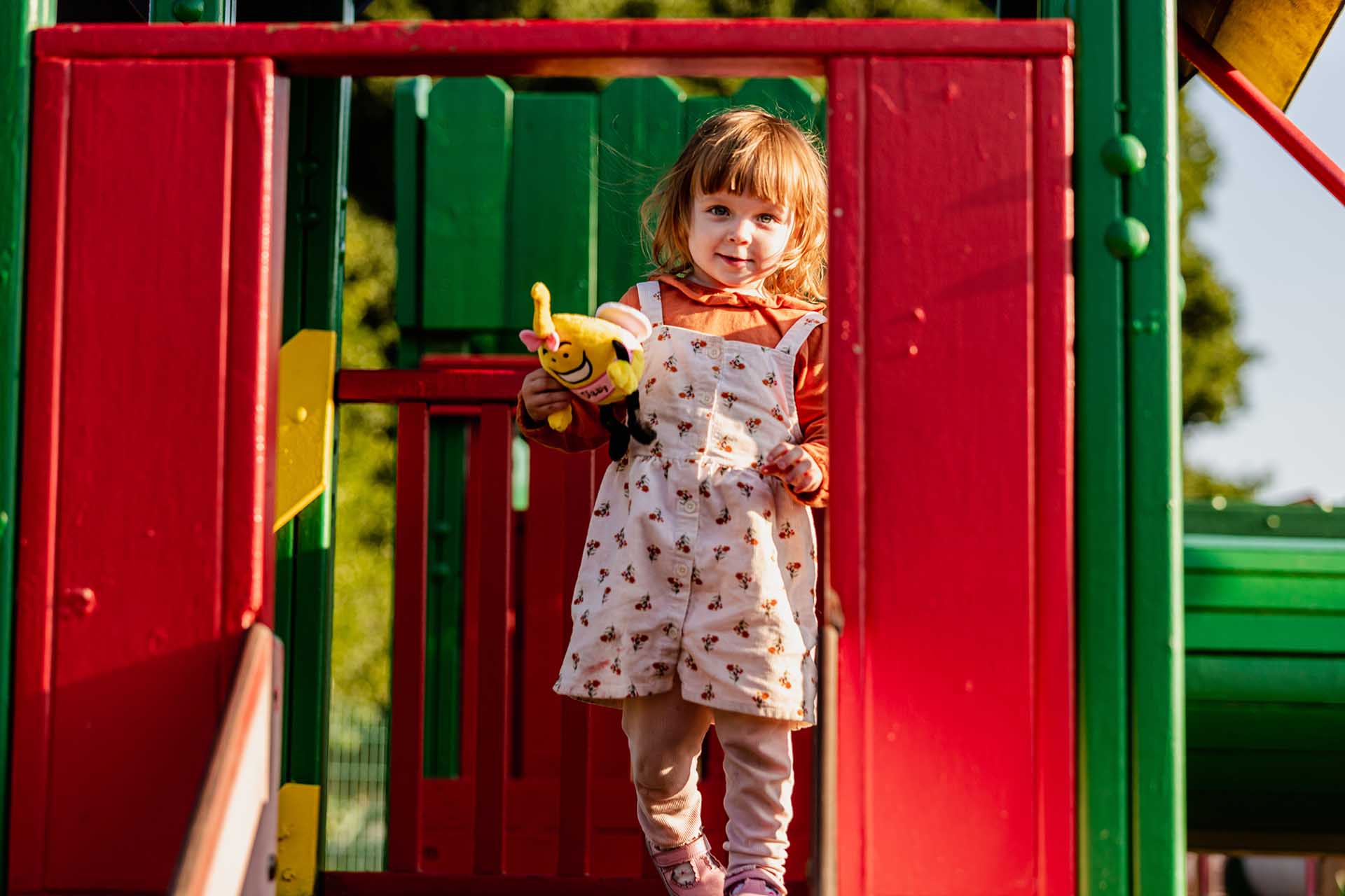 Little girl playing on apparatus in Welcome Fun Park