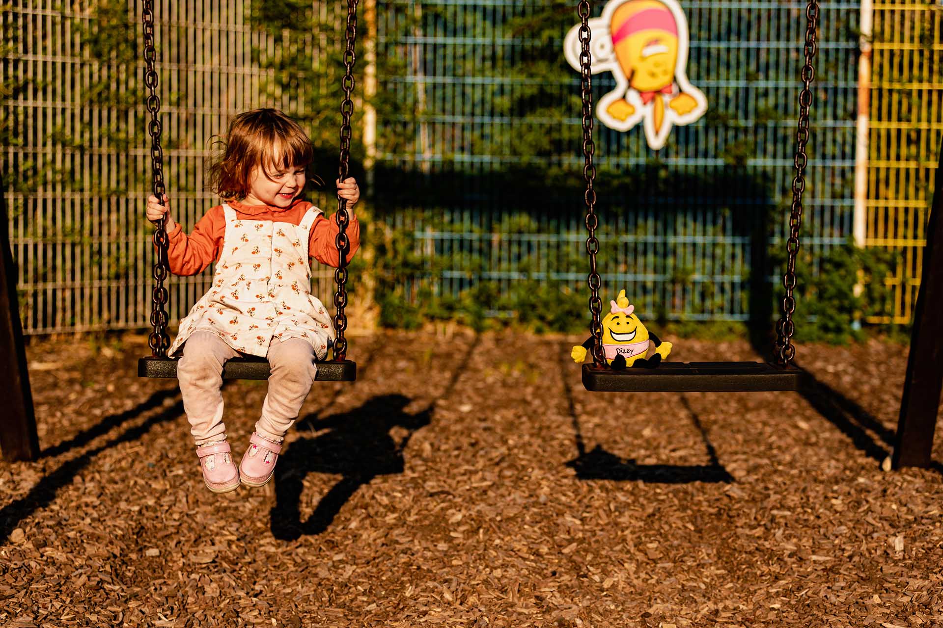 Little girl on swings in Welcome playground