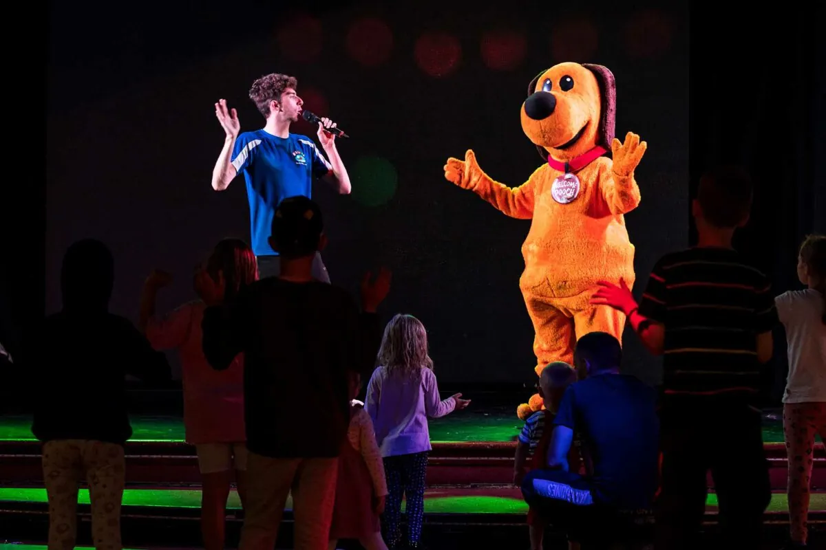 http://Children%20joining%20in%20the%20fun%20with%20Welcome%20character%20Dougie