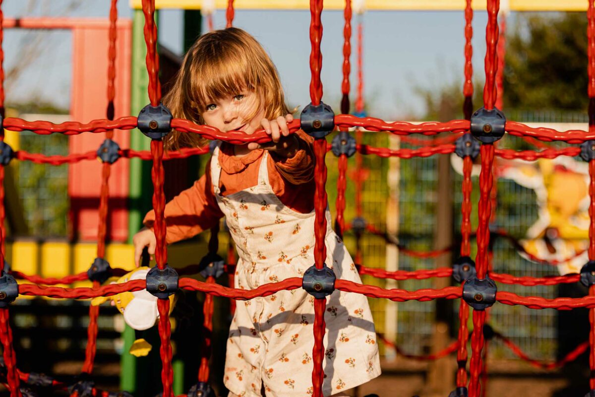 Girl playing in Welcome Adventure Playground